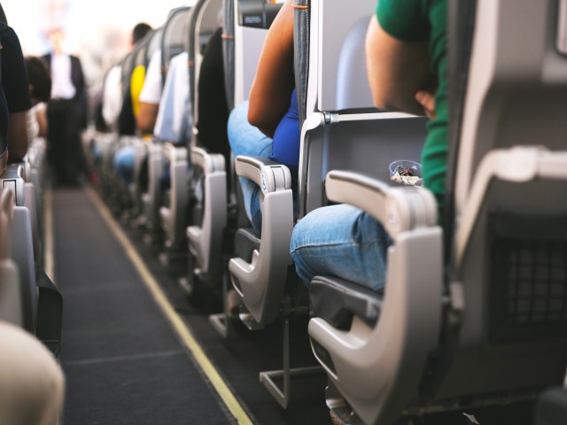 Close-up view of aircraft aisle armrests