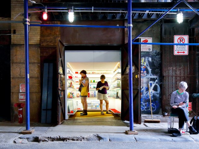 Museum goers exploring tiny gallery of Mmuseumm in New York City