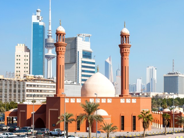 Red Mosque with Kuwait City skyline in background