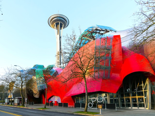 Colorful misshapen exterior of the Museum of Pop Culture in Seattle, Washington, with Space Needle in background