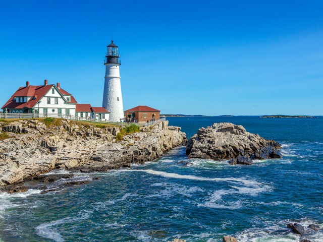 Lighthouse along rocky coastline of Maine