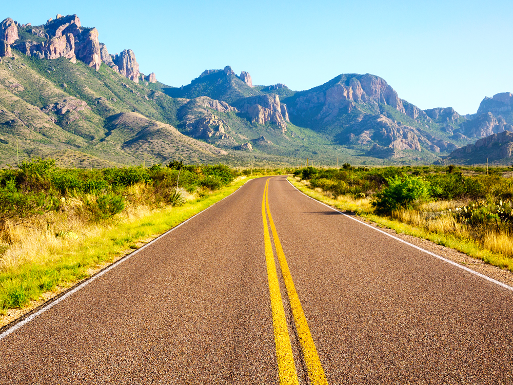 Empty road through mountains of Big Bend National Park in Texas