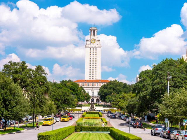 View of UT Tower down wide avenue at the University of Texas, Austin