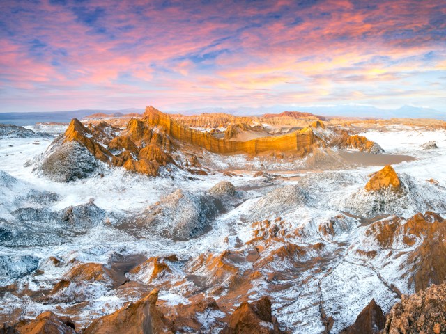 Snow-dusted landscape of the Atacama Desert in Chile at sunset, seen from above