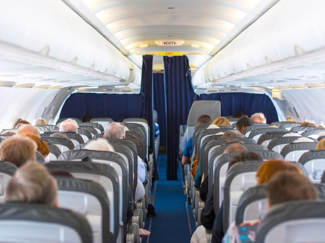 Aircraft cabin looking toward cockpit