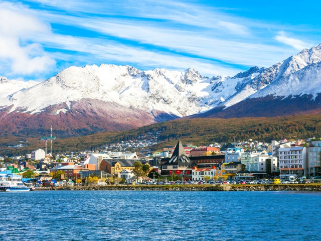 View of Ushuaia, Argentina, and snowy mountains from across bay