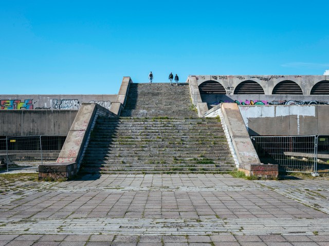 People walking steps of the Linnahall in Tallin, Estonia