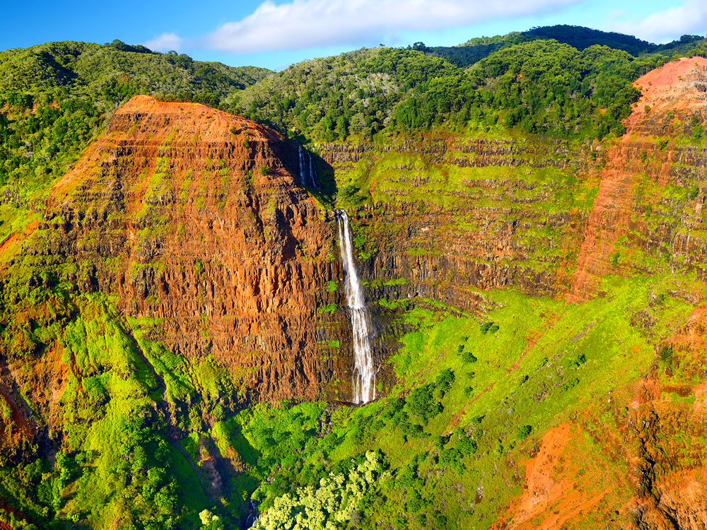 Waterfall falling over the walls of Waimea Canyon, Hawaii