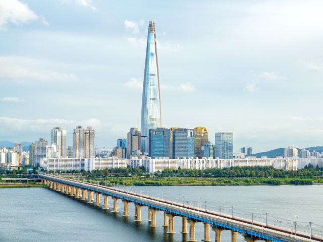 Bridge over Han River in Seoul, South Korea, with Lotte World Tower in distance