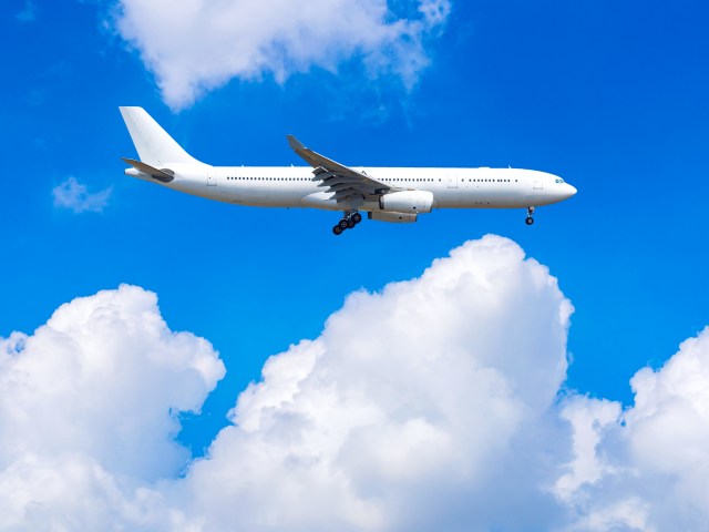 Aircraft flying above clouds