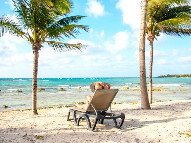 Person lounging on beach chair