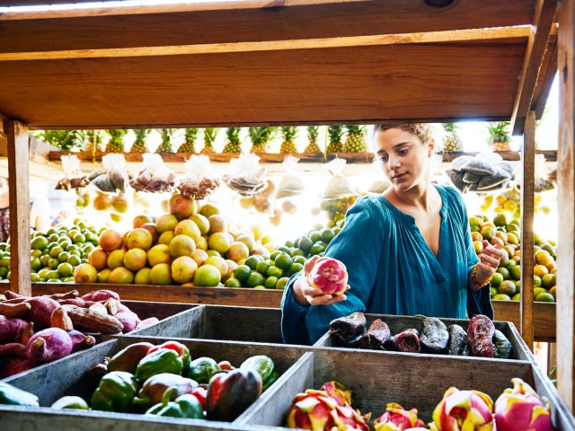 Woman browsing produce stand