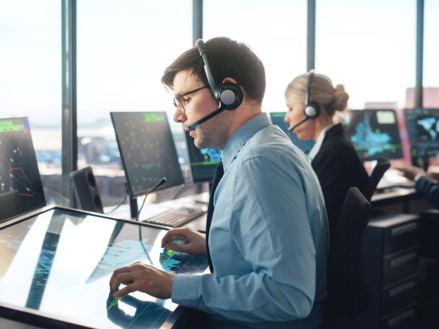 Air traffic controller in airport tower