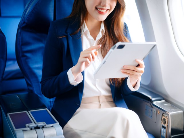 Airline passenger using tablet