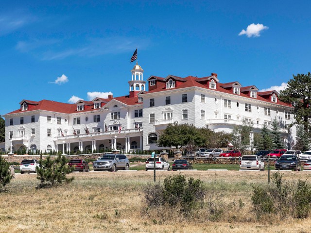 Cars parked in front of Stanley Hotel in Estes Park, Colorado