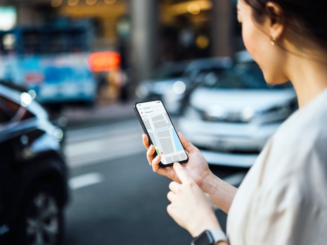 Person using map on cellphone to navigate city