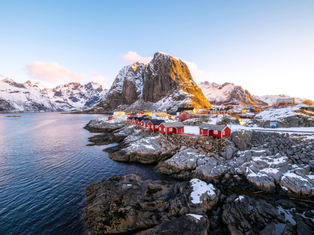 Aerial view of the Arctic Hideaway cabins perched on rocky coast in Norway