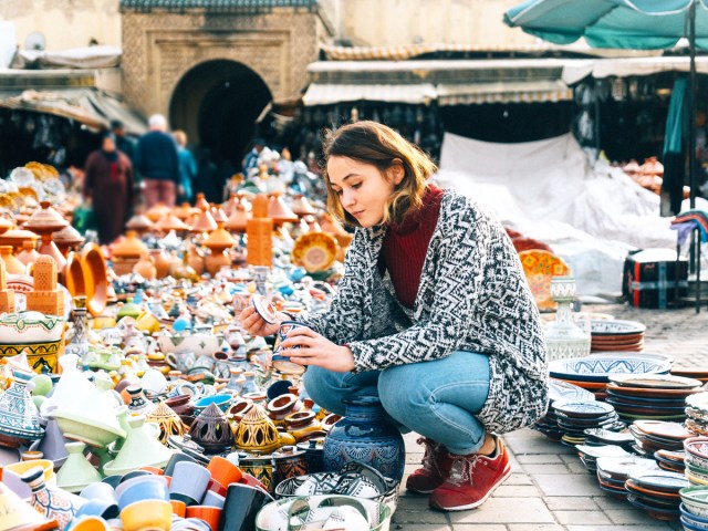 Traveler browsing pottery