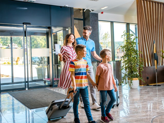 Family walking through hotel lobby