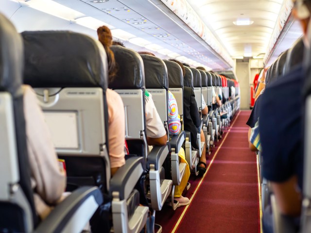 View of airplane cabin from back to front