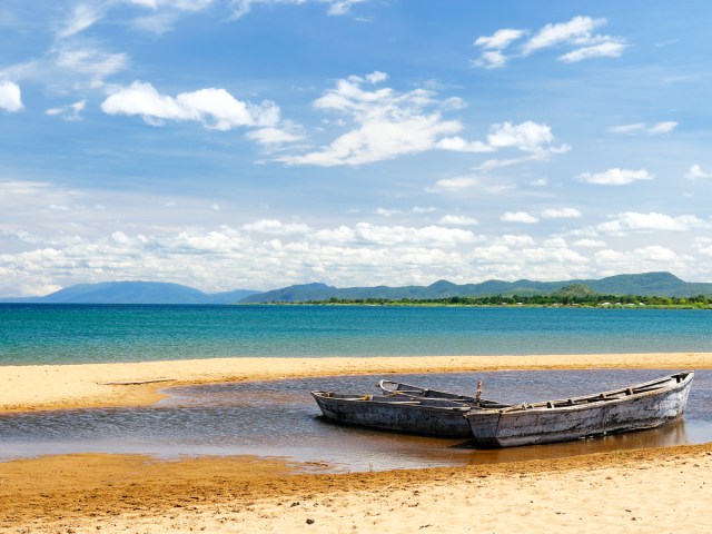 Empty boats on beach of Lake Tanganyika in East Africa