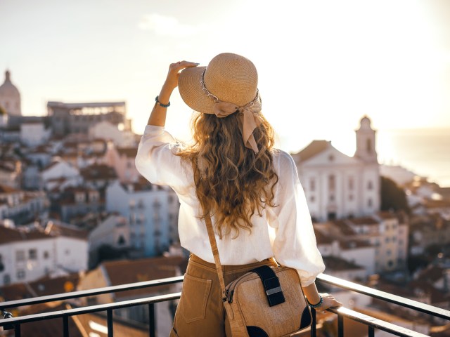 Woman looking out over cityscape