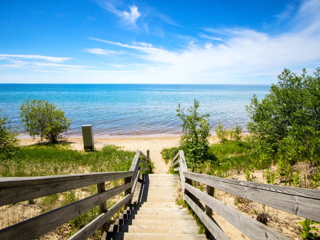 Wooden staircase leading to sandy beach on Lake Michigan