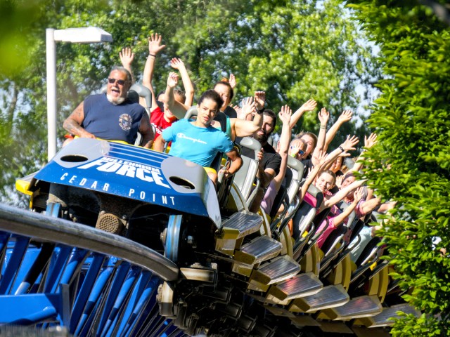 Close-up of riders on Millennium Force coaster at Cedar Point amusement park in Ohio