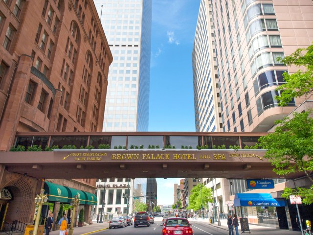 Pedestrian bridge over street in downtown Denver connecting buildings of the Brown Palace Hotel