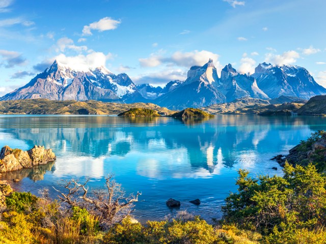 Jagged mountain peaks reflecting on lake in Chile's Torres del Paine National Park