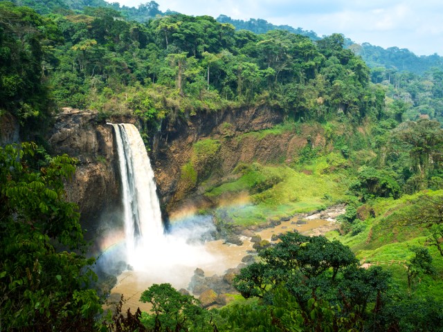 Rainbow shining over waterfall in Debundscha, Cameroon