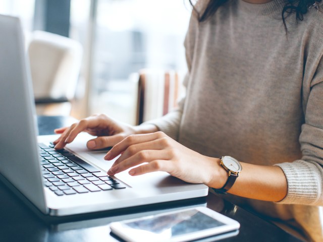 Person typing on laptop computer