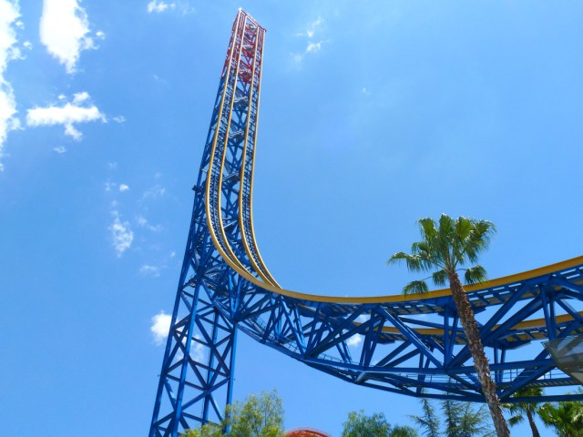 View of vertical track of SUPERMAN: Escape From Krypton ride against blue sky at Six Flags Magic Mountain in Santa Clarita, California