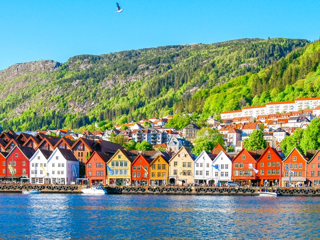 Colorful waterfront buildings with mountain in background in Bergen, Norway