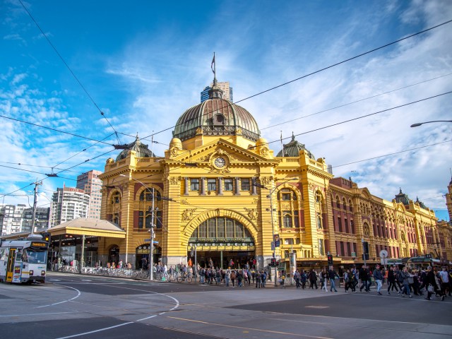 Distinctive yellow facade of Flinders Street Railway Station in Melbourne, Australia