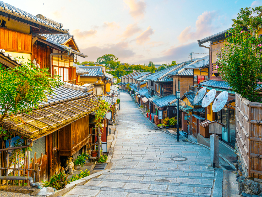 Narrow lane lined with historic architecture in Kyoto, Japan