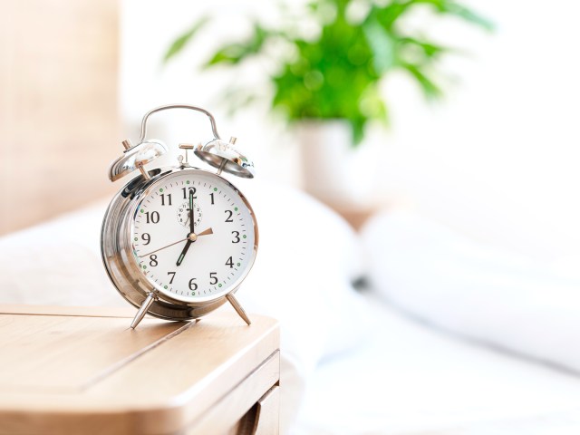 Retro alarm clock on bedside table