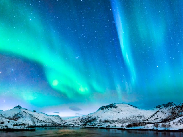 Northern lights above snowy landscape