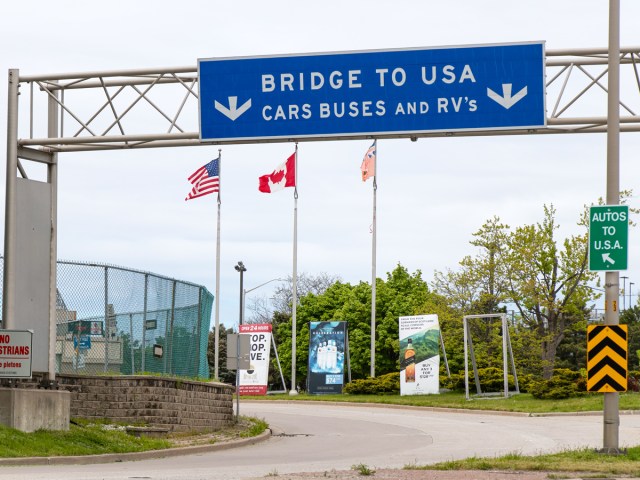 Canada-U.S. border crossing with signage indicating "Bridge to USA"