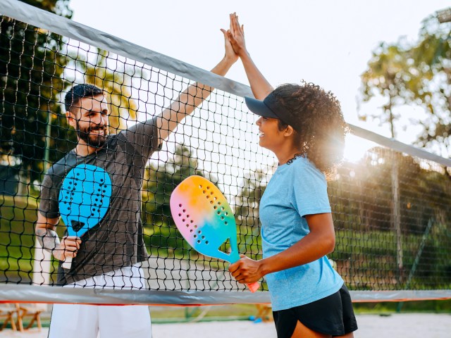 Opponents greeting each other at tennis court