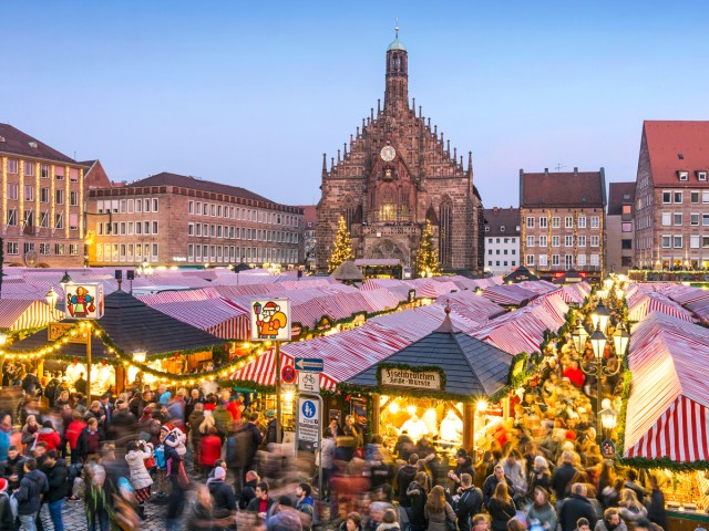 Stalls crowded with shoppers at Christkindlesmarkt in Nuremberg, Germany
