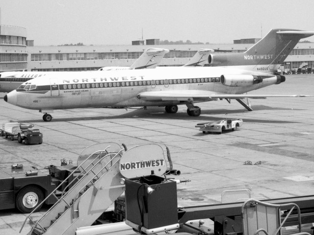 Historical image of Northwest Airlines Boeing 727 on airport tarmac