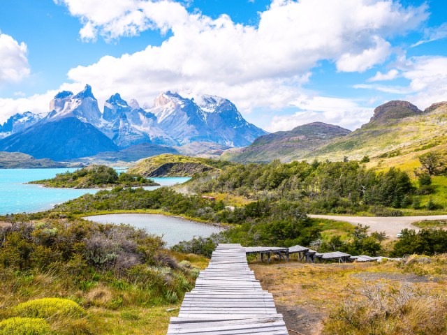 Elevated wood path through the terrain of Torres del Paine National Park in Chile