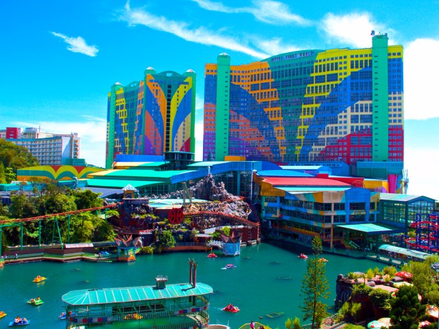 Pool area and colorful hotel towers at First World Hotel in Malaysia