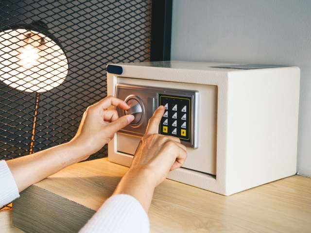 Hotel guest using safe in room