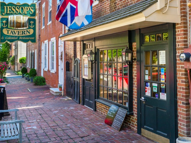 Sign and flags flying over Jessop's Tavern in New Castle, Delaware