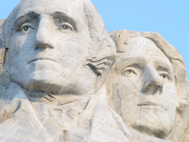 Close-up view of carved faces of George Washington and Thomas Jefferson on Mount Rushmore