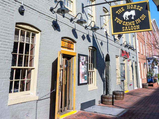 Sign and entrance to The Horse You Came In On Saloon in Baltimore, Maryland