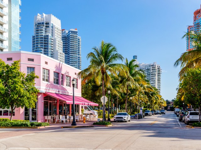 Pink art deco building with palm trees in Miami Beach, Florida