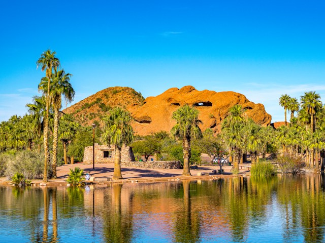 Papago Park with lake, palm trees, and desert scenery in Phoenix, Arizona